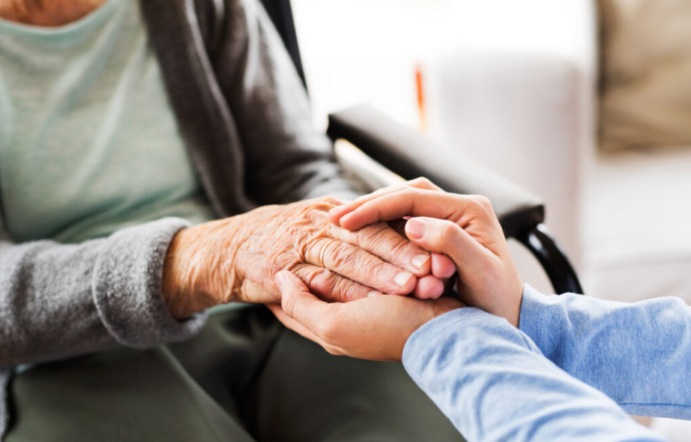 Unrecognizable,Health,Visitor,And,A,Senior,Woman,During,Home,Vis